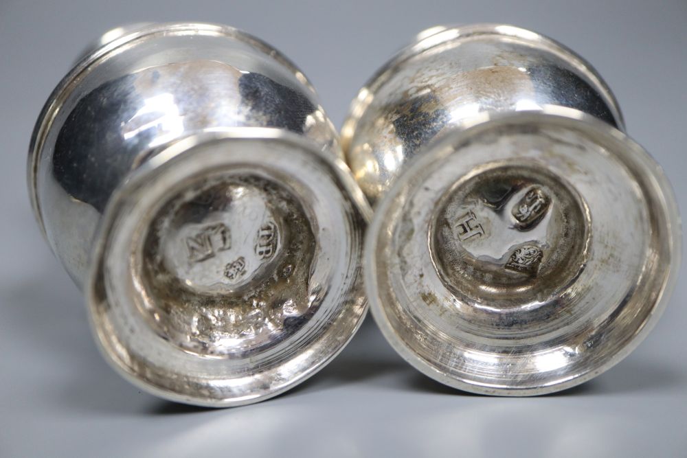 A matched pair of George I and George II silver pepperettes, Thomas Bamford, London, 1723 & 1728,